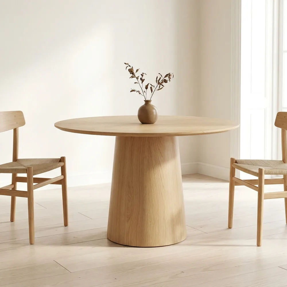 Round pedestal dining table in light oak